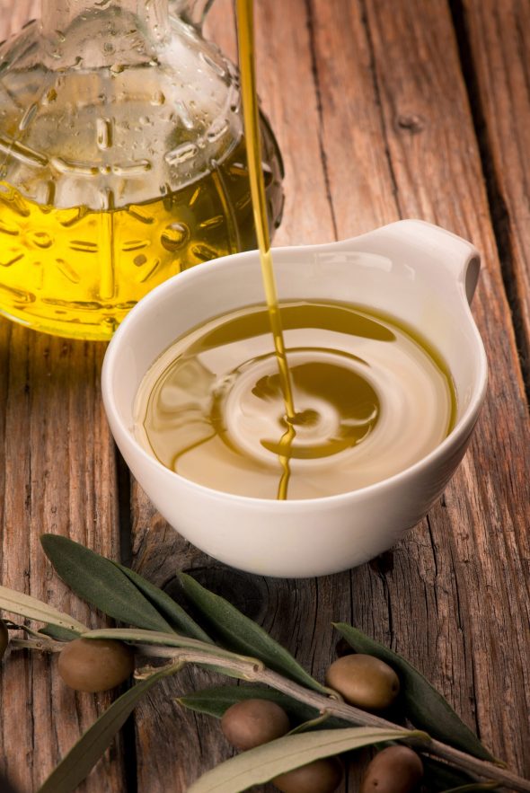 olive oil falling over the bowl